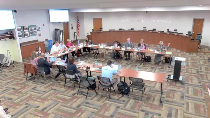 CPS School Board Members and school administrators in a U-shaped set up at their March 19, 2026, meeting.