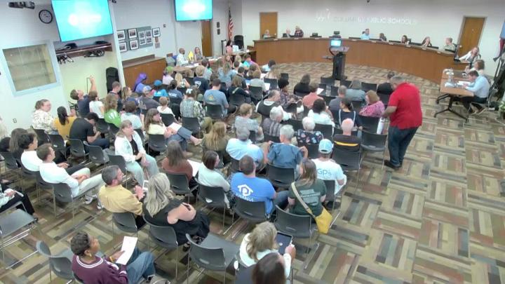CPS School Board Members at the dais in front of audience members at the May 11, 2026, meeting.