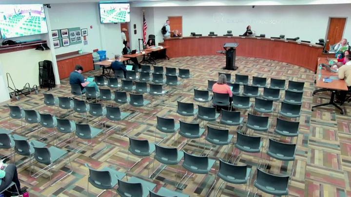 CPS School Board Members at the dais in front of audience members at the July 13, 2026, meeting.